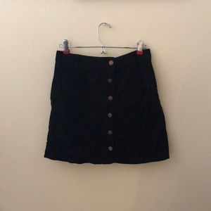 black corduroy miniskirt with buttons
